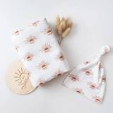 Muslin Baby Cotton Blanket Swaddle Blanket Set | Boho Rust Clay Sunbeams Gender Neutral White Girls | Rust Sunset Sunshine | A blanket receives a newborn