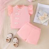 SHEIN Baby Girl Comfortable And Elegant Chinese-Style Element Buckle Ruffle Trim Fashionable Pink Top And Shorts Summer Two-Piece Set