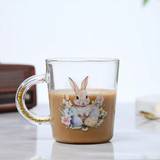 SHEIN 1pc 500ml Easter Egg & Rabbit Themed Glass Mug With Built-In Gold Particles In The Handle, Eye-Catching & Festive Gift For Easter, Suitable For Drinki