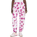 34 - Batik Tøj Nike Sportswear-tie-dye-bukser fleece til kvinderSportswear Women's Fleece Tie-Dye Trousers - Active Pink/Siren Red/Black