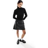 Morgan Kjoler Morgan – Svart 2-i-1-klänning med stickad polotröja och minikjol läderimitation-Svart/a
