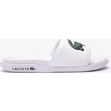Lacoste 44 ½ Hjemmesko & Sandaler Lacoste SERVE SLIDE DUAL 09221CMA white male Sandals & Slides now available at BSTN in