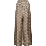 Gucci Silke Bukser & Shorts Gucci GG Supreme wide-leg silk pants brown