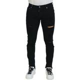Dolce & Gabbana Sort Bukser & Shorts Dolce & Gabbana Black Slim Fit Tattered Denim Cotton Jeans IT48