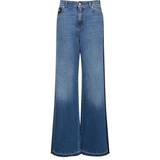 Alexander McQueen Blå Bukser & Shorts Alexander McQueen Womens Worn Wash Contrast-panel Mid-rise Wide-leg Jeans