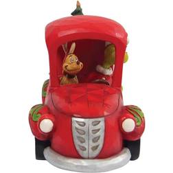 Disney Grinch i rød truck med juletræ